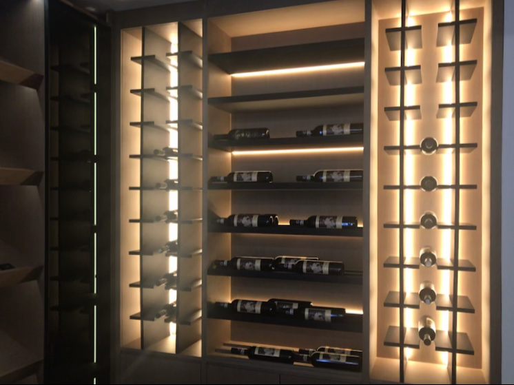 What lights are installed in the wine cabinet to create the atmosphere